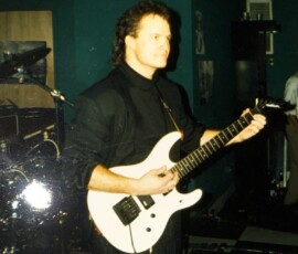 Gregg playinf Flip Moore's Washburn electric. I don't recall the song we did this on.
